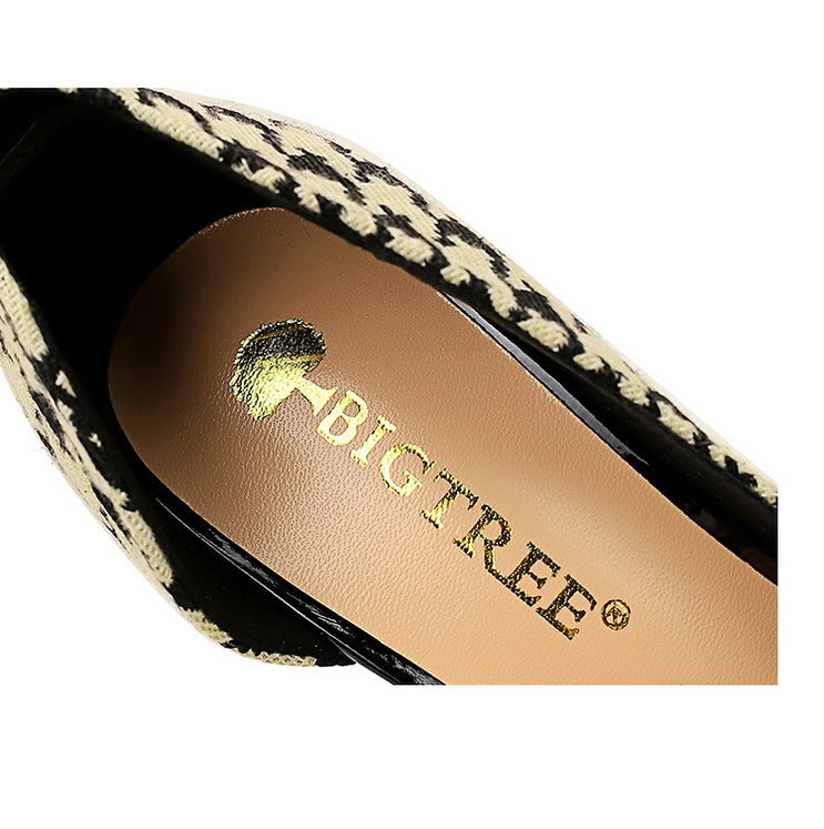 Inside View of Women's black and cream patterned high heels with elegant pearls and intricate gold detailing. Showcasing the label BIGTREE on the inside.