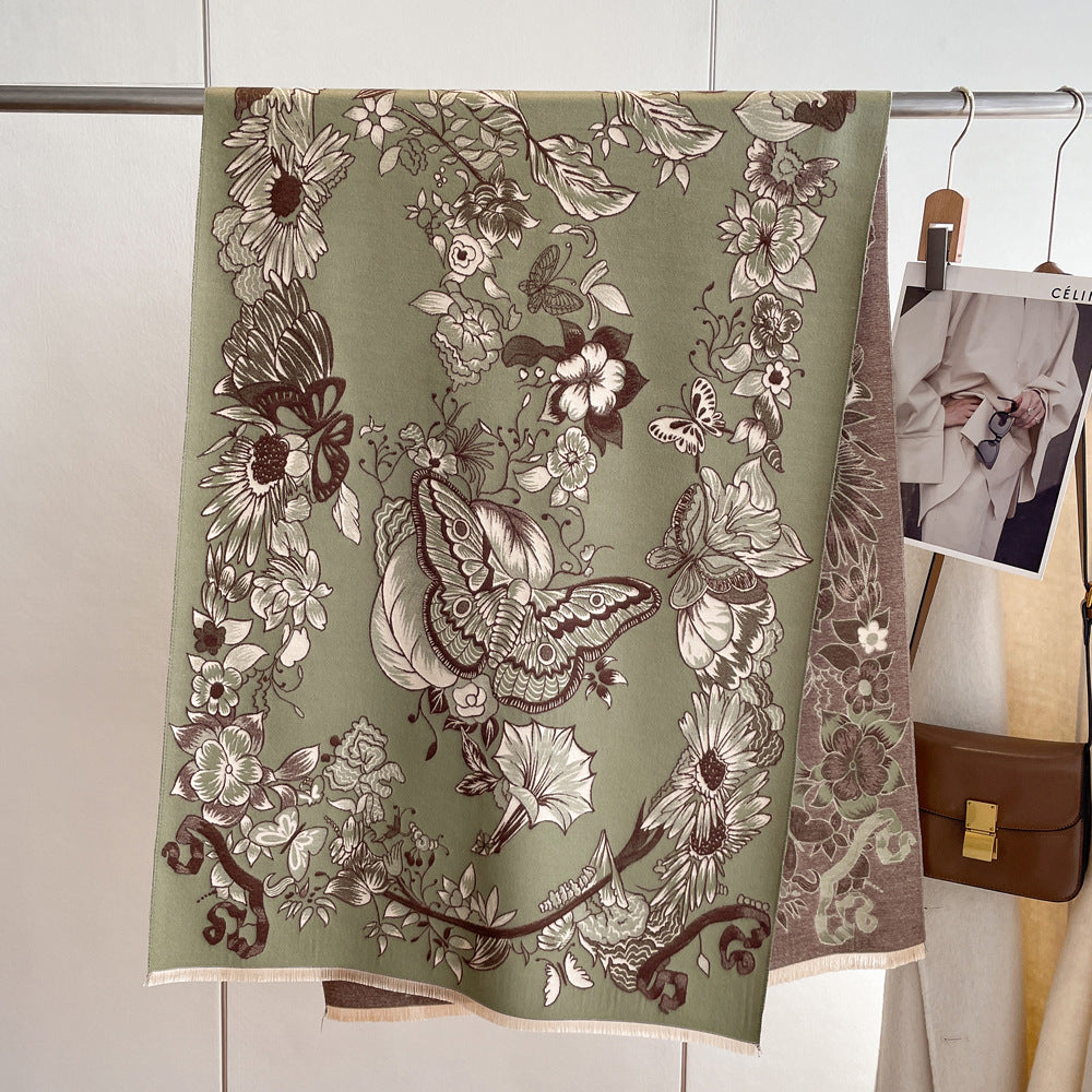 A green floral print cashmere scarf with butterflies stands gracefully beside a car, exuding elegance and style.