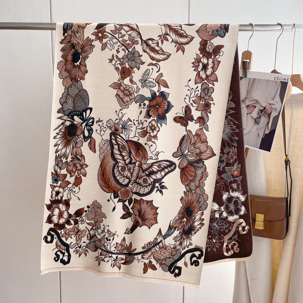 A brown floral print cashmere scarf with butterflies stands gracefully beside a car, exuding elegance and style.