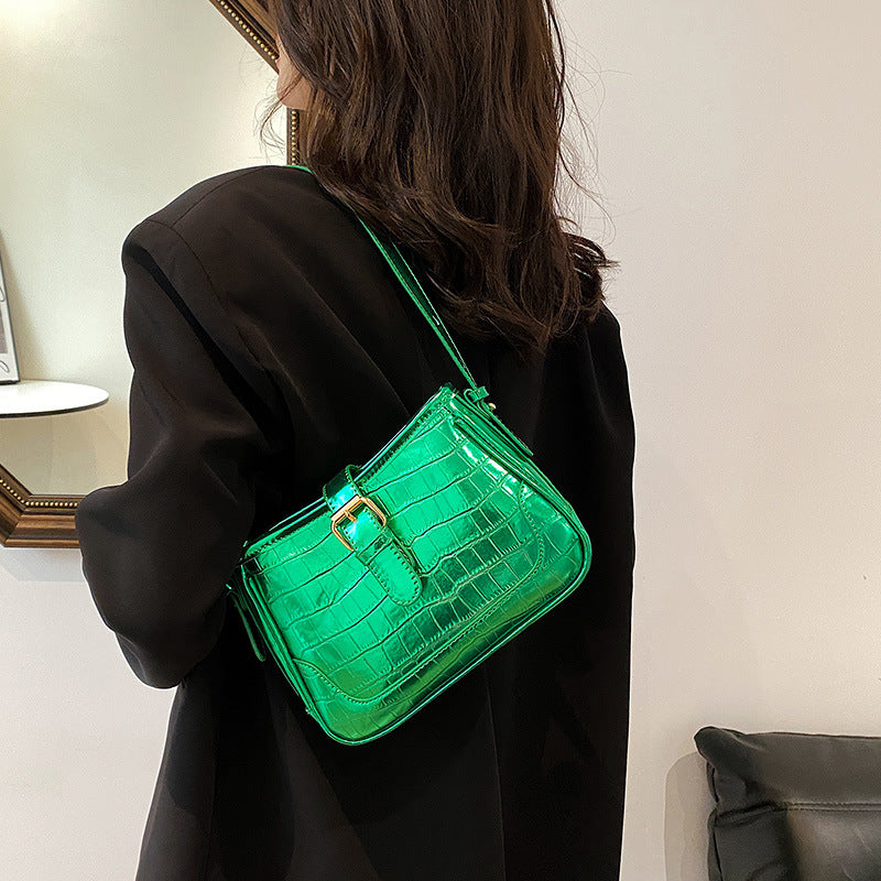 A green crocodile print bag.