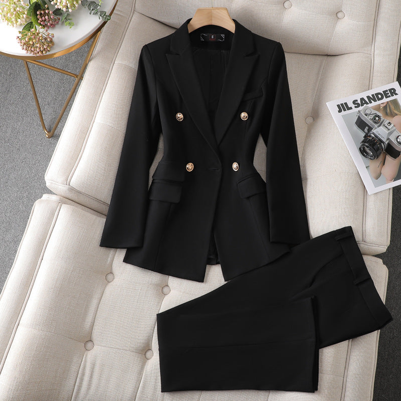 A black suit and pants neatly placed on a couch, creating a sophisticated and elegant look.