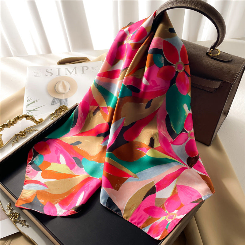 "Pink vibrant silk scarf, purse, and handbag with floral and leaf patterns."