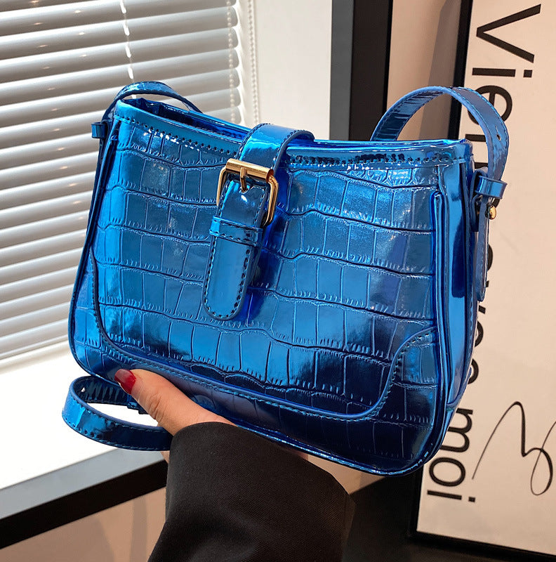 A blue crocodile print bag.